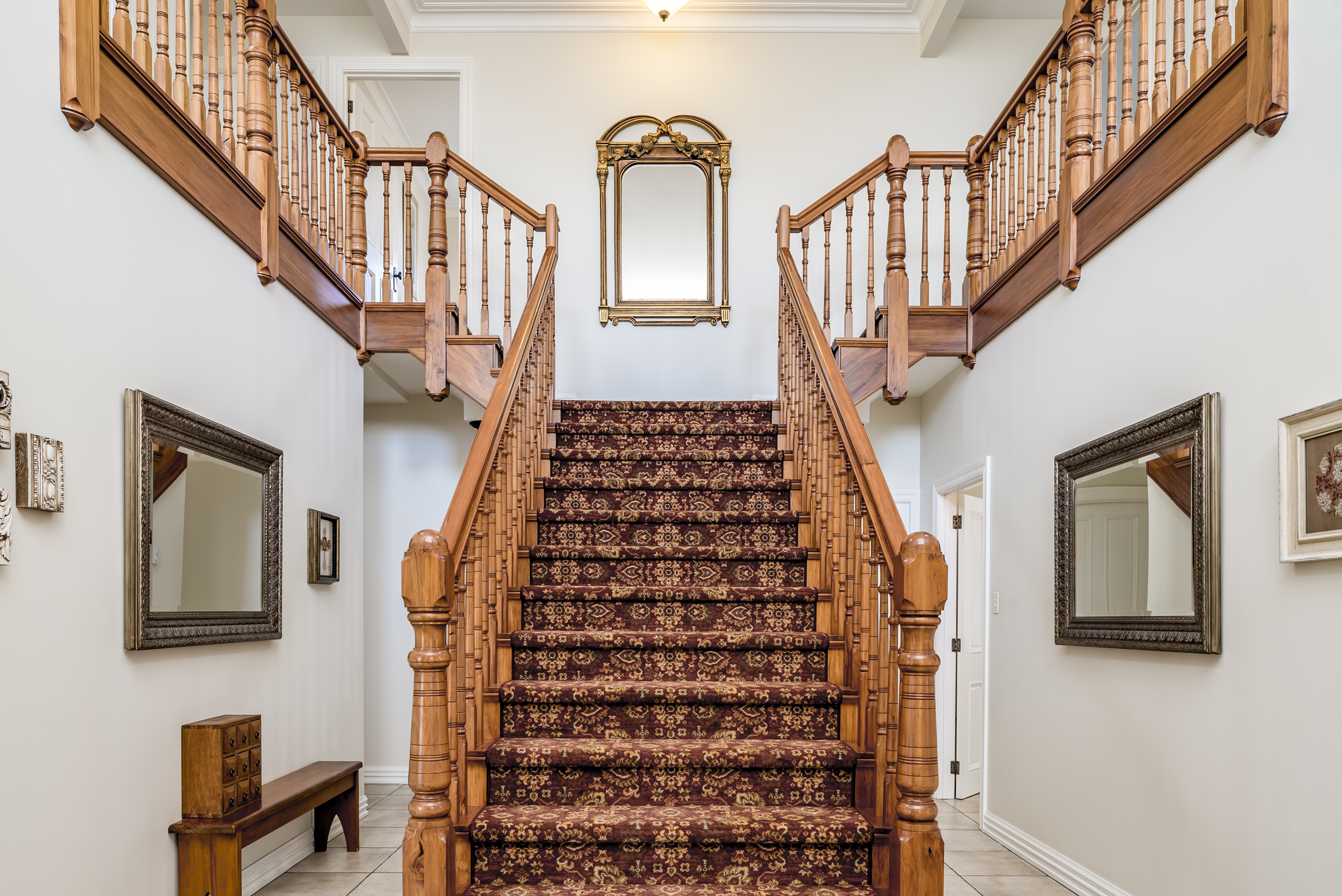 The grand 8-foot staircase entrance at Whiskey Mansion Ranch